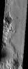 NASA's Mars Odyssey spacecraft captured this image in July 2003, showing the central uplift of an impact crater on Mars that formed by inward and upward movement of material below the crater floor during the crater-forming event.