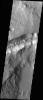 NASA's Mars Odyssey spacecraft captured this image in July 2003, showing graben (fracture) in Memnonia Fossae, noteworthy because one can still see large blocks on the floor. These blocks most likely dropped down from above when the fracture opened up.