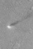 NASA's Mars Global Surveyor shows a dust devil in the Phlegra region of Mars. Dust devils are spinning, columnar vortices of air that move across a landscape, picking up dust as they go.