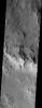 NASA's Mars Odyssey spacecraft captured this image in Sept 2003, showing the northern rim of Hale Crater on Mars, located in Noachis Terra, heavily dissected by the enigmatic gullies whose origin has been attributed to snow melt, ground water discharge.