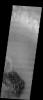 NASA's Mars Odyssey spacecraft captured this image in September 2003, showing dark dunes sit on a rough, eroding sedimentary surface in the floor of a crater on Mars, one of dozens in Noachis Terra, to have both dark dunes and an eroding surface.