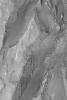 NASA's Mars Global Surveyor shows some of the layered, sedimentary rock outcrops exposed on a mound in Gale Crater on Mars.