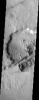 NASA's Mars Odyssey spacecraft captured this image in September 2003, shows a crater has been sliced by the tectonic forces that produced the rift known as Sirenum Fossae.