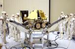In the Payload Hazardous Servicing Facility, technicians reopen the lander petals of the Mars Exploration Rover 2 (MER-2) to allow access to one of the spacecraft's circuit boards.