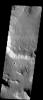 A relatively dusty plateau with some spur and gully topography is visible along its southern edge as well as amphitheater shaped alcove in this image taken in November 2003 by NASA's Mars Odyssey spacecraft.