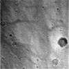 This black and white image, taken by NASA's Mars Exploration Rover Spirit's lander in 2004, shows a view of Gusev Crater as the lander descends to Mars. Numerous small impact craters can be seen on the surface of the planet.
