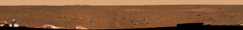 This is a medium-resolution version of the first 360-degree panoramic view of the martian surface, taken on Mars by NASA's Mars Exploration Rover Spirit's panoramic camera. Part of the spacecraft can be seen in the lower corner regions.