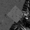 This image taken by the panoramic camera onboard NASA's Mars Exploration Rover Spirit highlights the first patch of soil examined by the rover's microscopic imager. The rover can be seen to the right.
