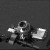 NASA's Mars Exploration Rover Opportunity shows the rover's alpha particle X-ray spectrometer (circular device in center), located on its instrument deployment device, or 'arm.'