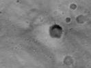NASA's Mars Global Surveyor shows Gusev Crater on Mars. The Spirit/Columbia Memorial Station is clearly seen as a bright feature, as are the parachute and backshell from which the rover Spirit was detached.