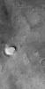 NASA's Mars Global Surveyor shows a lonely, light-toned butte composed of sedimentary rock in northern Sinus Meridiani on Mars.