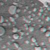 This 3-D anaglyph, from NASA's Mars Exploration Rover Spirit, shows an extreme close-up of round, blueberry-shaped grains on the crater floor near the rock outcrop at Meridiani Planum called Stone Mountain. 3D glasses are necessary.