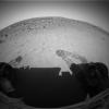 This image shows NASA's Mars Exploration Rover Spirit's view from its location inside the shallow depression dubbed 'Laguna Hollow.' Tracks in the soil show that Spirit drove forward a bit, wiggled its wheels, then turned and backed up. 