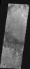This image from NASA's 2001 Mars Odyssey released on Jan 28, 2004 shows layered material in a crater on Meridiani Planum on Mars.