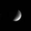 Saturn's crescent moon Dione hangs before NASA's Cassini spacecraft in this magnified image taken on July 19, 2004.