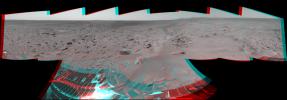 NASA's Mars Exploration Rover Spirit took this 3-D navigation camera mosaic of the crater called 'Bonneville.' The rover's solar panels can be seen in the foreground. 3D glasses are necessary to view this image.