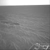 This image from NASA's Mars Exploration Rover Opportunity is part of the first set of pictures that was returned to Earth after the rover exited 'Eagle Crater.' Plentiful ripples are seen on the plains and two depressions featuring bright spots.