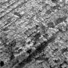 A microscopic image shows variability of grain size, medium-sized, well rounded and sorted, within a parallel-stratified portion of the 'Slickrock' area in the martian rock outcrop examined by NASA's Mars Exploration Rover Opportunity.