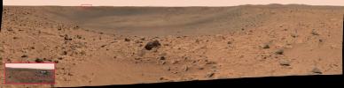NASA's Mars Exploration Rover Spirit acquired this panoramic camera image on the March 12, 2004. The reflective speck about 200 meters (650 feet) away, on the far crater rim, was identified as Spirit's protective heatshield.