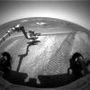 This image taken by the hazard-avoidance camera on NASA's Mars Exploration Rover Opportunity shows the rover investigating a bright patch of soil dubbed 'Mont Blanc' on Meridiani Planum.