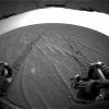 The rear hazard-avoidance camera on NASA's Mars Exploration Rover Opportunity caught this view of the rover's freshly made tracks after a record drive of 100 meters (328 feet) during sol 70 of the rover's mission (April 5, 2004).