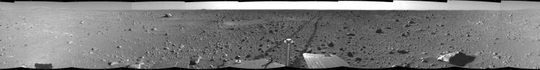 This cylindrical-projection view was created from navigation camera images that NASA's Mars Exploration Rover Spirit acquired on May 12, 2004. The tracks show the path the rover had traveled so far on its way to the base of the 'Columbia Hills.'