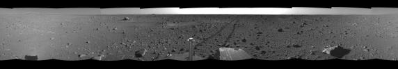 This right-eye view was created from navigation camera images that NASA's Mars Exploration Rover Spirit acquired on May 12, 2004. The tracks show the path the rover had traveled so far on its way to the base of the 'Columbia Hills.'