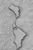 NASA's Mars Global Surveyor shows two large and many small mesas composed of frozen carbon dioxide on the south polar cap of Mars.