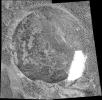This mosaic of four images from the microscopic imager on NASA's Mars Exploration Rover Opportunity shows the freshly exposed interior of a rock dubbed 'Lion Stone' after the rover's rock abrasion tool ground away a circular patch of the rock's surface.