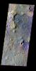 This false-color image released on May 21, 2004 from NASA's 2001 Mars Odyssey of ejecta (top-left) from a rampart crater on Mars was acquired March 3, 2003, during northern summer.