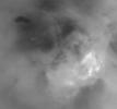 Although it is far too cold for blossoming flowers, summer does bring storm clouds and presumably rain to Titan's south polar region, as shown in the image from NASA's Cassini spacecraft.