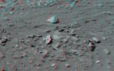 This 3-D image taken by the left and right eyes of the panoramic camera on NASA's Mars Exploration Rover Spirit shows the odd rock formation dubbed 'Cobra Hoods' (center). 3D glasses are necessary to view this image.