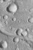 NASA's Mars Global Surveyor shows a cluster of impact craters and large, light-toned, windblown ripples occurring in many of the depressions in this portion of the Amenthes Fossae region of Mars.