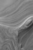 NASA's Mars Global Surveyor shows extensive deposits of layered material beneath the ice caps of both martian poles.