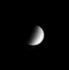 This image from NASA's Cassini spacecraft shows Titan, Saturn's largest moon (5,150 kilometers, or 3,200 miles, across), with a streak-like cloud near its south pole.