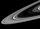 As NASA's Cassini spacecraft swung around to the dark side of the planet during its first close passage after orbit insertion, the intrepid spacecraft spied three ring moons whizzing around the planet.