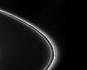 This image captured by NASA's Cassini spacecraft shows intriguing features resembling drapes and kinks, which are visible in this view of Saturn's thin F ring.