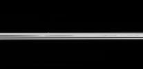 The small ring moon Atlas is seen here, on the far side of Saturn's immense ring system. NASA's Cassini spacecraft was only 0.6 degrees above the ring plane when this image was taken.