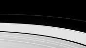 Saturn's little moon Atlas orbits Saturn between the outer edge of the A ring and the fascinating, twisted F ring. This image from NASA's Cassini spacecraft just barely resolves the disk of Atlas.