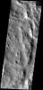This dust avalanche is located on the rim material of an unnamed crater to the east of Tikhonravov Crater on Mars as seen by NASA's 2001 Mars Odyssey.