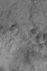 NASA's Mars Global Surveyor shows groupings of large ripple-like windblown bedforms on the floor of a large crater in Sinus Sabaeus, south of Schiaparelli Basin on Mars.