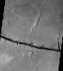 This image released on August 30, 2004 from NASA's 2001 Mars Odyssey shows Cerberus Fossae on Mars, comprised of two east/west oriented linear depressions. Fossae is a long, narrow, shallow depression.