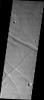 This image from NASA's 2001 Mars Odyssey shows the south of the rim of Valles Marineris on Mars. The troughs seen in this image are structural features called graben.