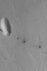 NASA's Mars Global Surveyor shows a small line of collapsed pits that follow the trend of the regional Cerberus Fossae troughs on Mars.