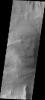 This image released on Sept 28, 2004 from NASA's 2001 Mars Odyssey shows a layered rock formation on Mars that is located in Candor Chasma.