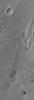 NASA's Mars Global Surveyor shows streamlined islands and a small cataract in an outflow channel system in the Zephyria region of Mars, south of Cerberus. 