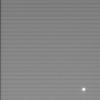 The European Space Agency's Huygens probe appears shining as it coasts away from Cassini in this image taken on Dec. 26, 2004, just two days after the probe successfully detached from NASA's Cassini spacecraft.