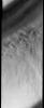 This image released on Oct 28, 2004 from NASA's 2001 Mars Odyssey shows the Martian north polar cap. Streamers of dust moving downslope over the darker trough sides showing the laminar flow regime coming off the cap. 