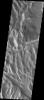 This image released on Nov 9, 2004 from NASA's 2001 Mars Odyssey shows collapse pits in an area of 'sulci' ridges east of Olympus Mons on Mars. Graben cut the ridges, and one graben hosts the collapse pits.