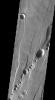 This image released on Nov 12, 2004 from NASA's 2001 Mars Odyssey shows collapse pits are found within graben surrounding Alba Patera on Mars. Alba Patera is an old volcano that has subsided after its magma chamber was evacuated.